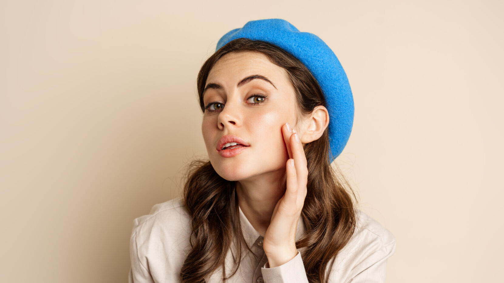 close up portrait young beatufiul woman looking mirror fixing her makeup touching soft cle scaled e1751084342798